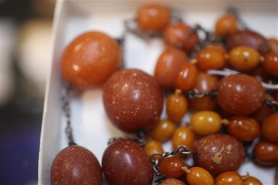 Two single strand amber bead necklaces, longest 56in.